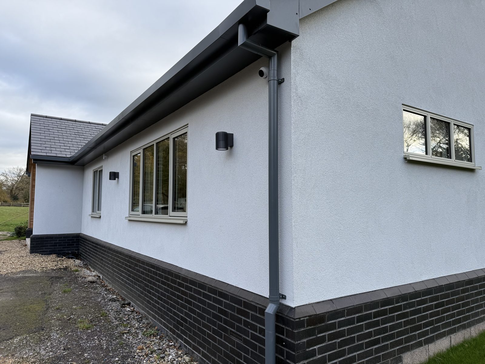 Round downpipe detail on a UK property