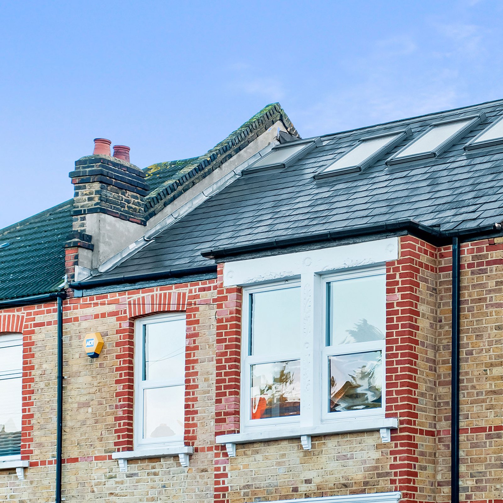 UK house with a restored and coated tiled roof
