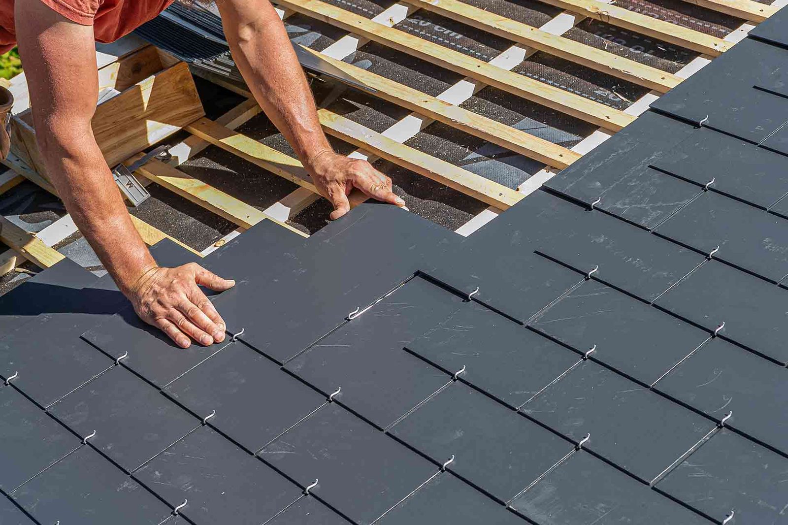 Slate roof repair being carried out on a UK home