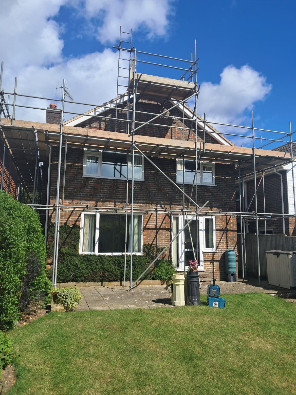 Scaffolded UK property undergoing building and roofing work